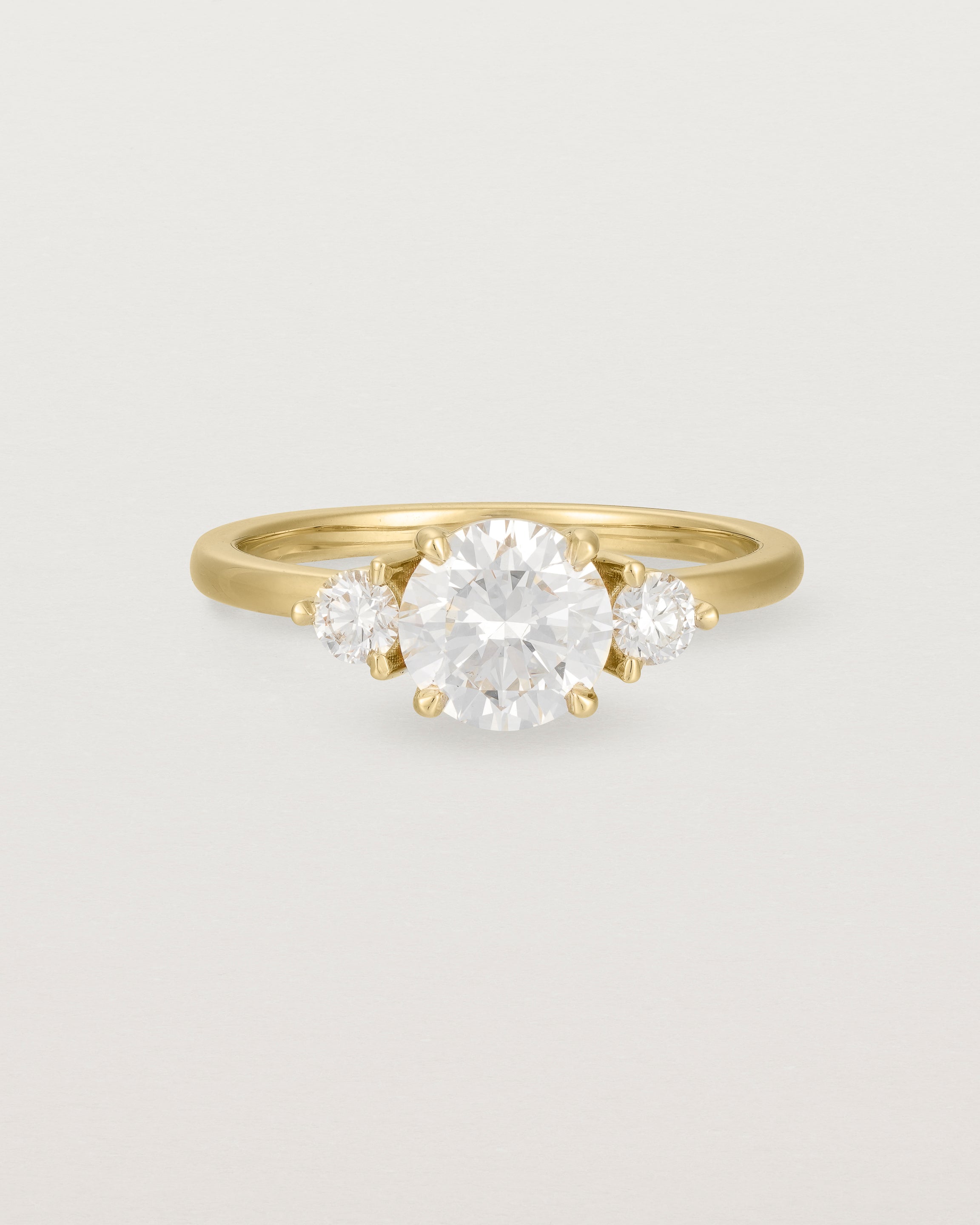 Front view of the Petite Una Round Trio Ring | Laboratory Grown Diamonds | Yellow Gold.