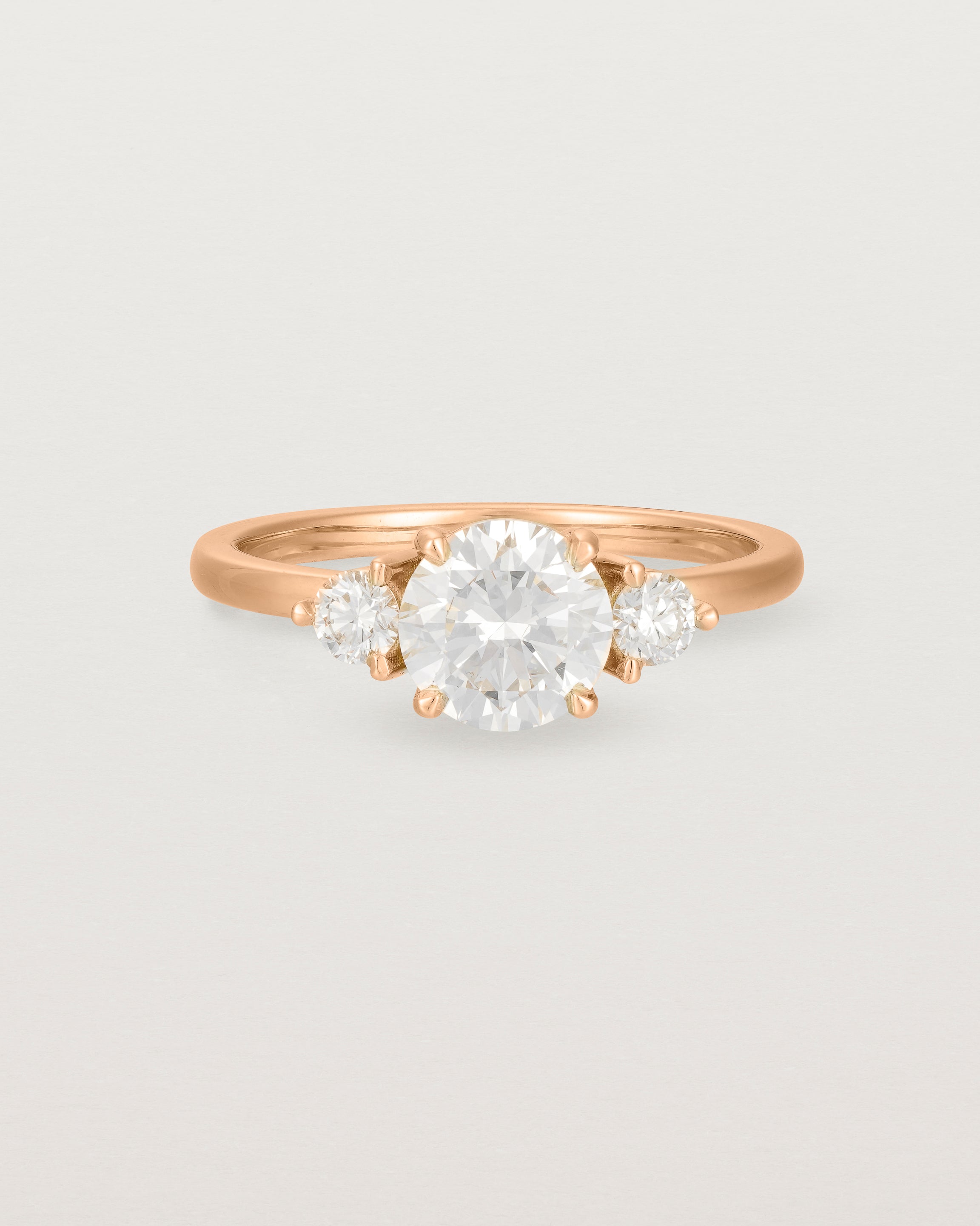 Front view of the Petite Una Round Trio Ring | Laboratory Grown Diamonds | Rose Gold.