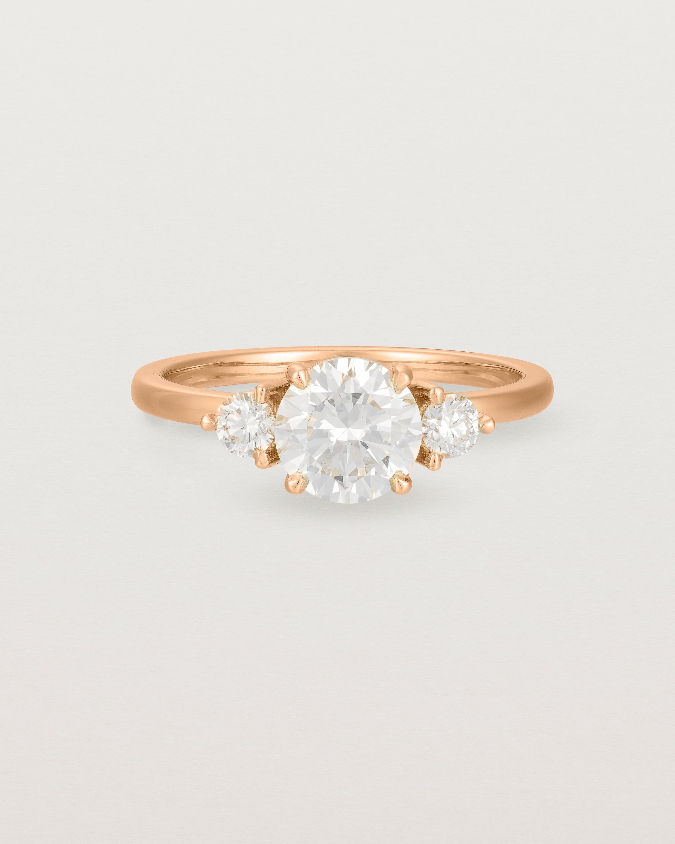 Front view of the Petite Una Round Trio Ring | Laboratory Grown Diamonds | Rose Gold.