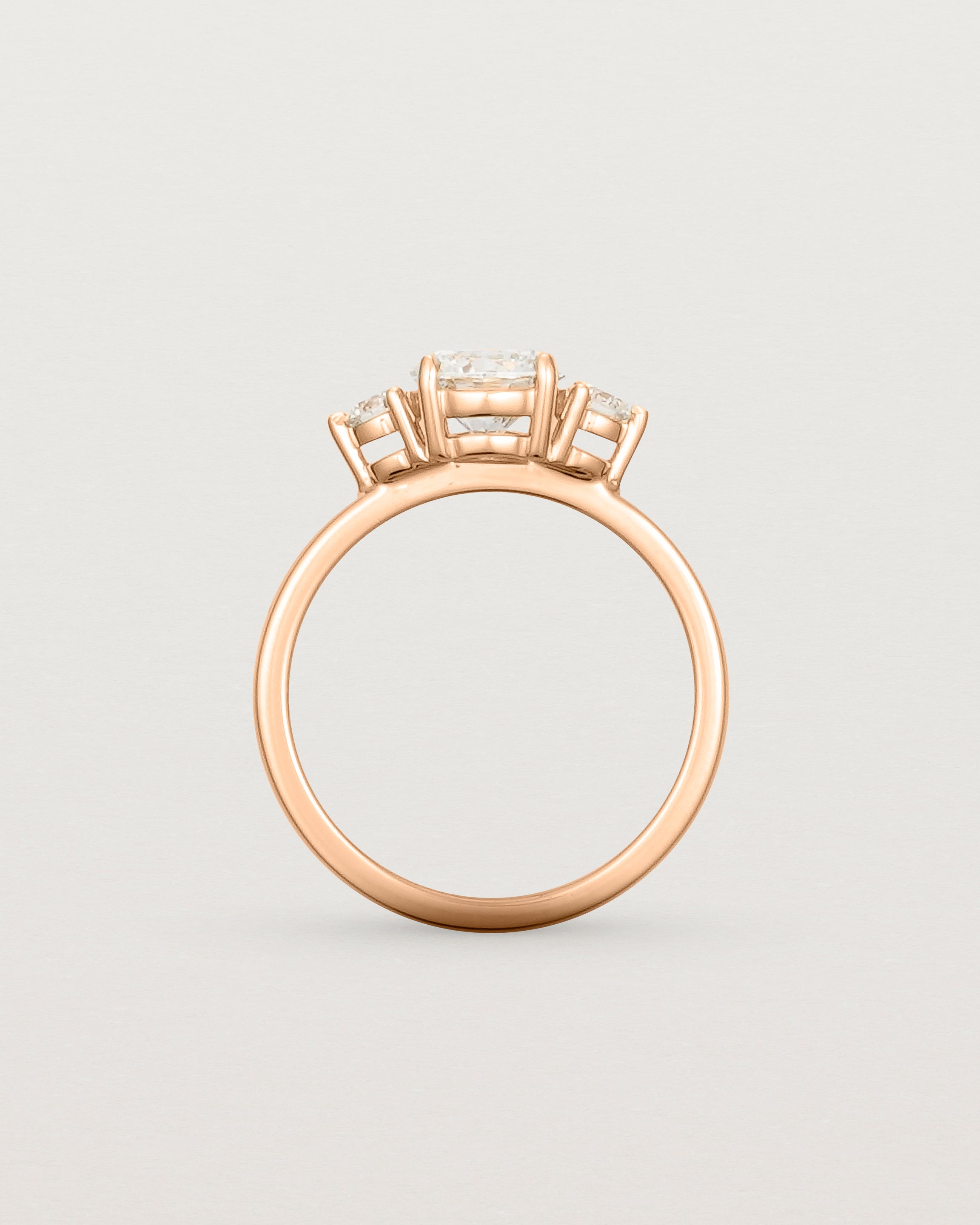 Standing view of the Petite Una Round Trio Ring | Laboratory Grown Diamonds | Rose Gold.