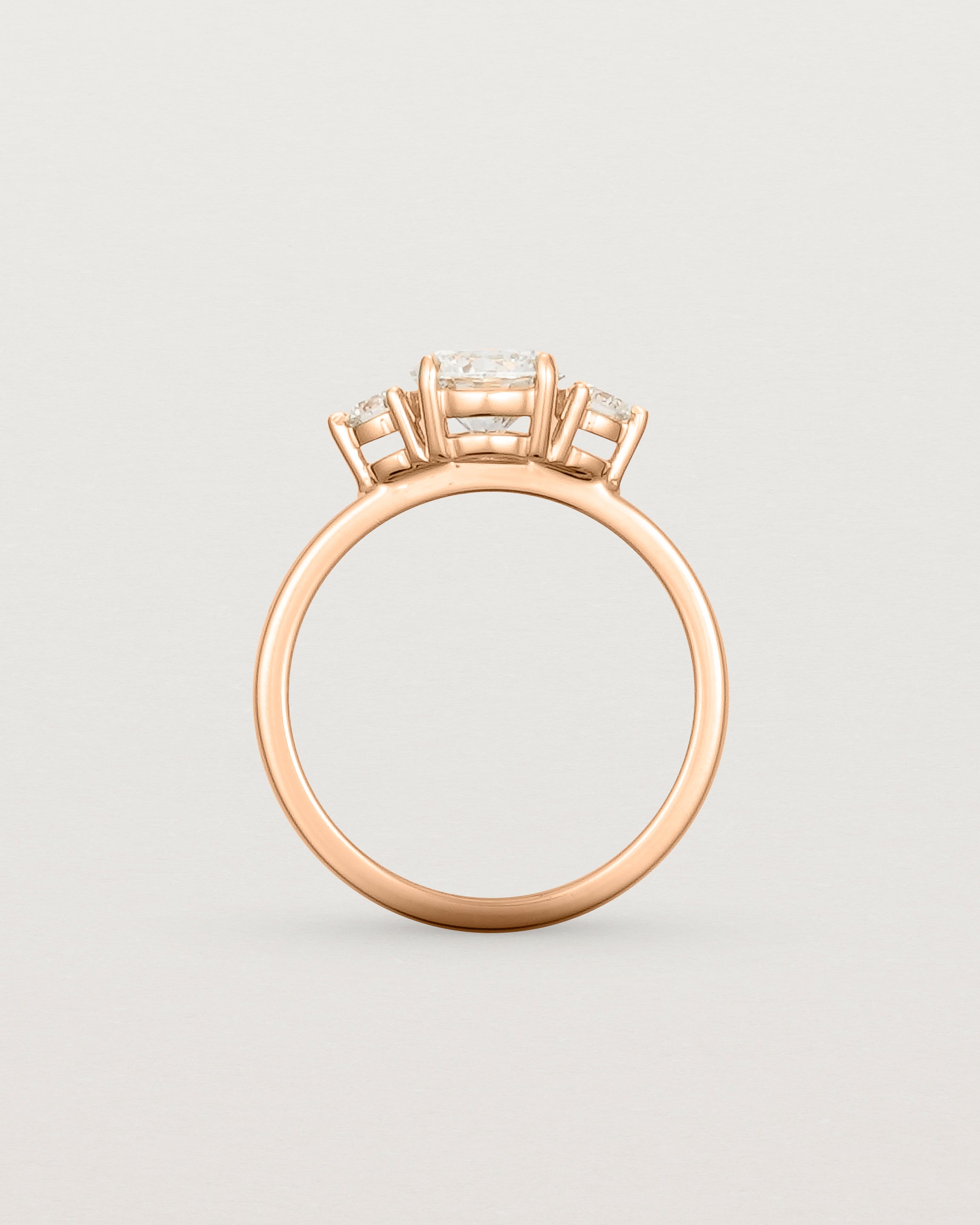 Standing view of the Petite Una Round Trio Ring | Laboratory Grown Diamonds | Rose Gold.