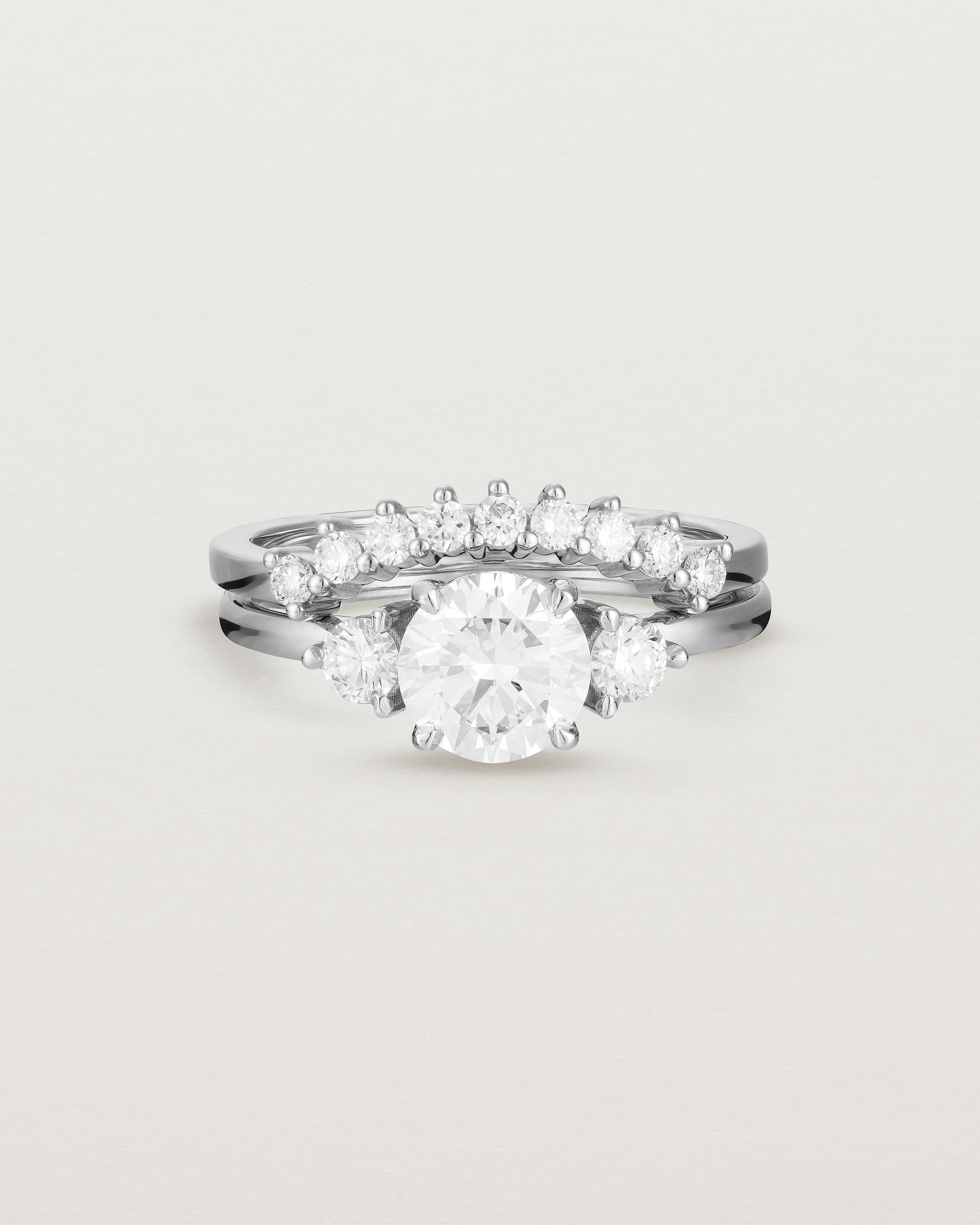 Front view of the Petite Una Round Trio Ring | Laboratory Grown Diamonds | White Gold with the Reina Crown Ring | Diamonds. 