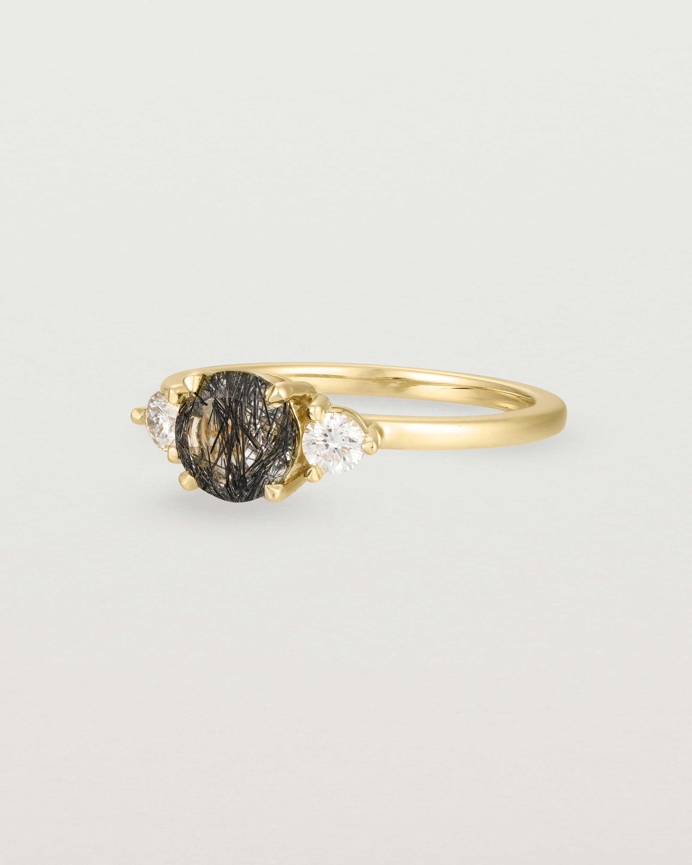 Angled view of the Petite Una Round Trio Ring | Tourmalinated Quartz & Diamonds | Yellow Gold.
