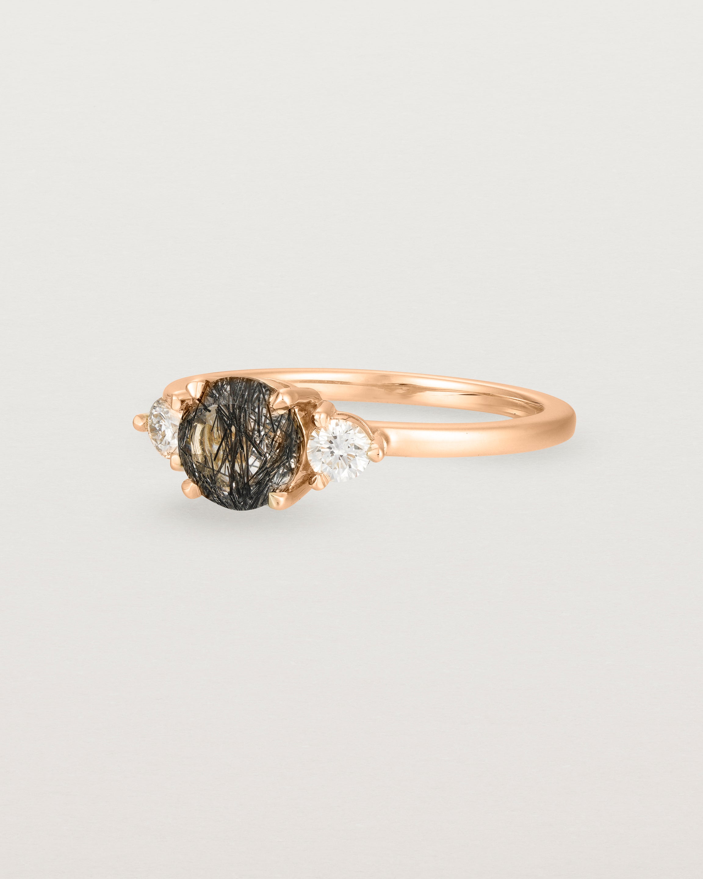 Angled view of the Petite Una Round Trio Ring | Tourmalinated Quartz & Diamonds | Rose Gold.