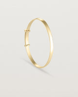 standing image of the Toujours bangle millgrain in yellow gold