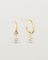 front of image of the pair of Starburst Petit Diamond Hoops on in yellow gold.