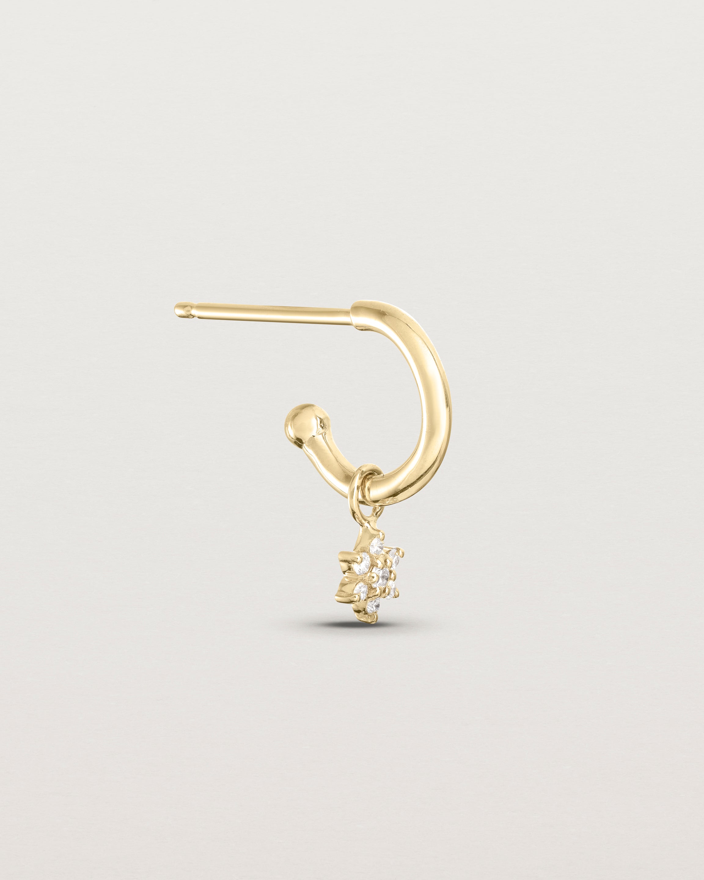 Side image of the pair of Starburst Petit Diamond Hoops on in yellow gold.
