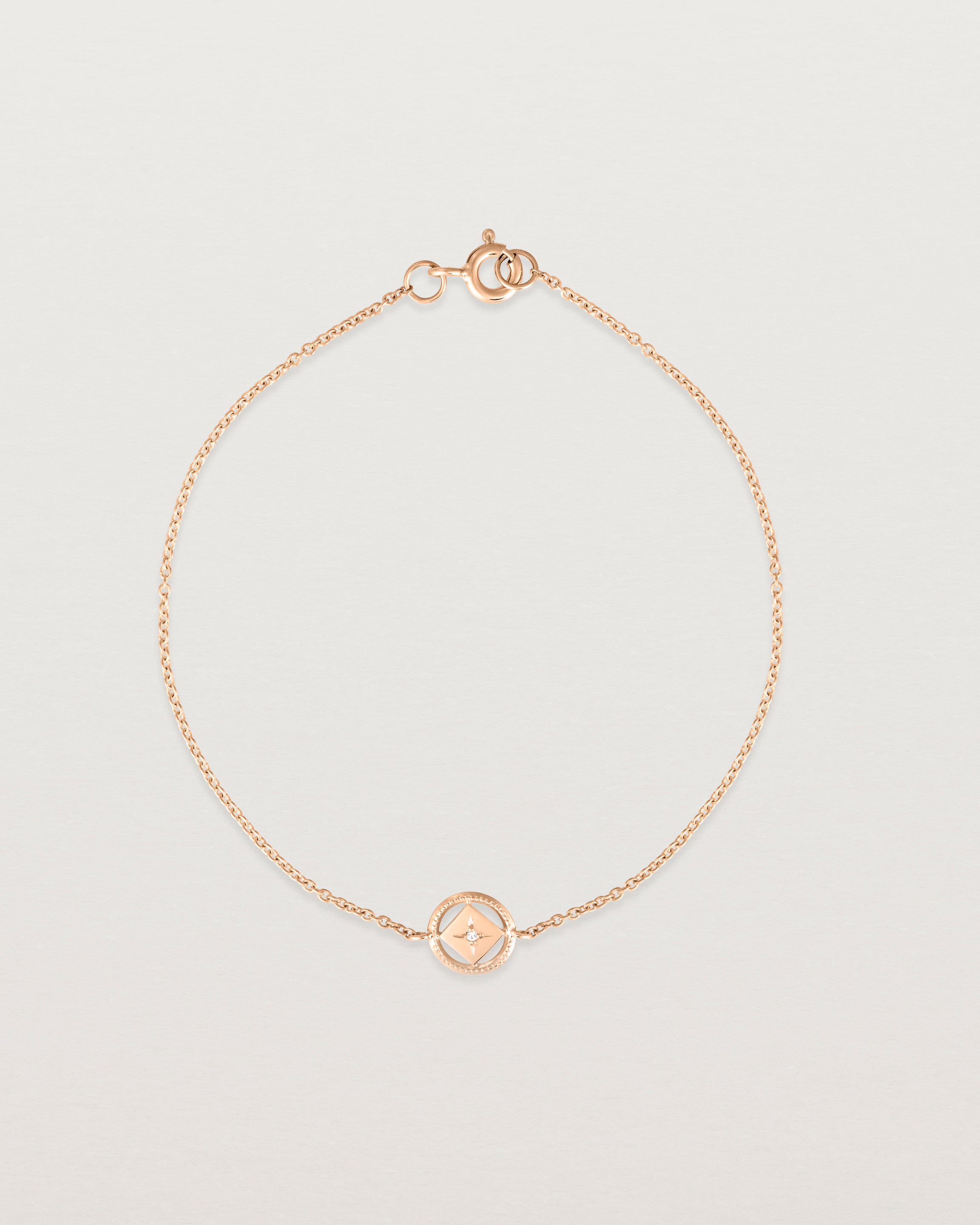 Full view of the Polaris Bracelet | Birthstone in rose gold with a white diamond.