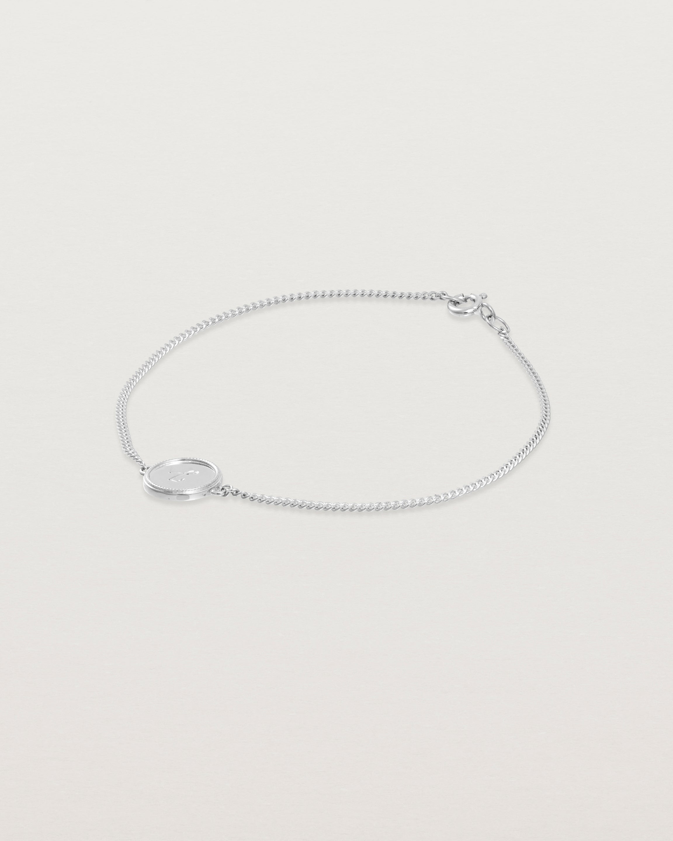 Angled view of the Precious Initial Bracelet in white gold.