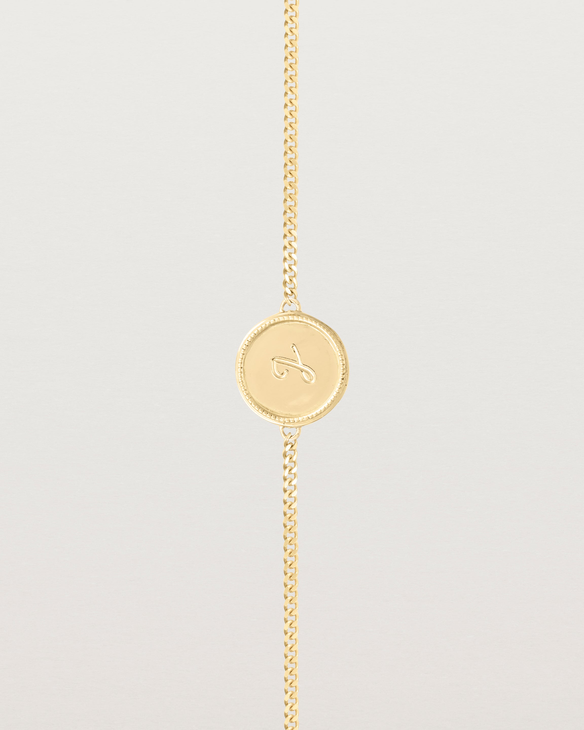 Close up of the Precious Initial Bracelet in Yellow Gold.
