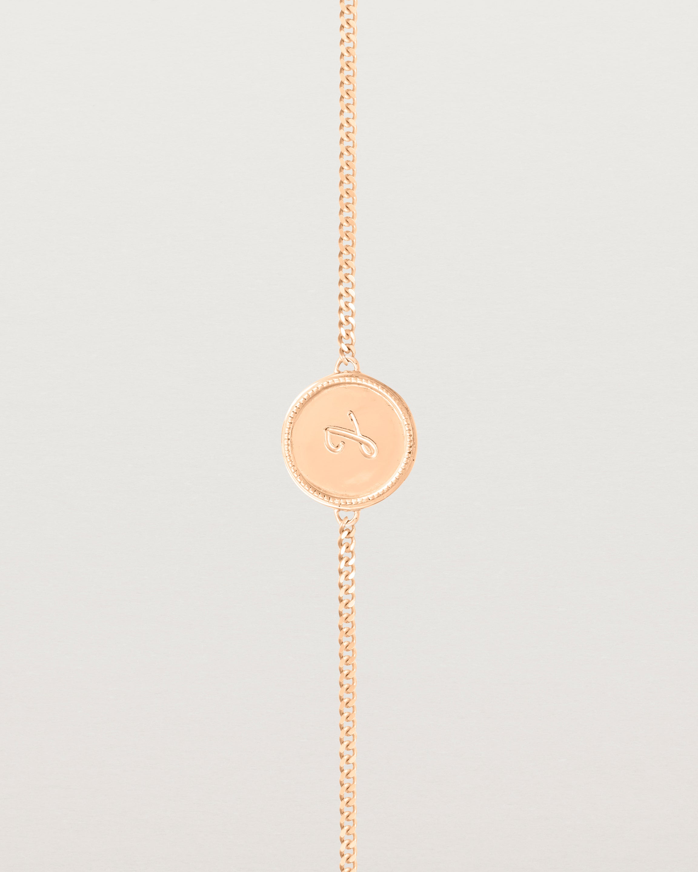 Close up view of the Precious Initial Bracelet in rose gold.