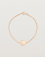 Top down view of the Precious Initial Bracelet in rose gold.