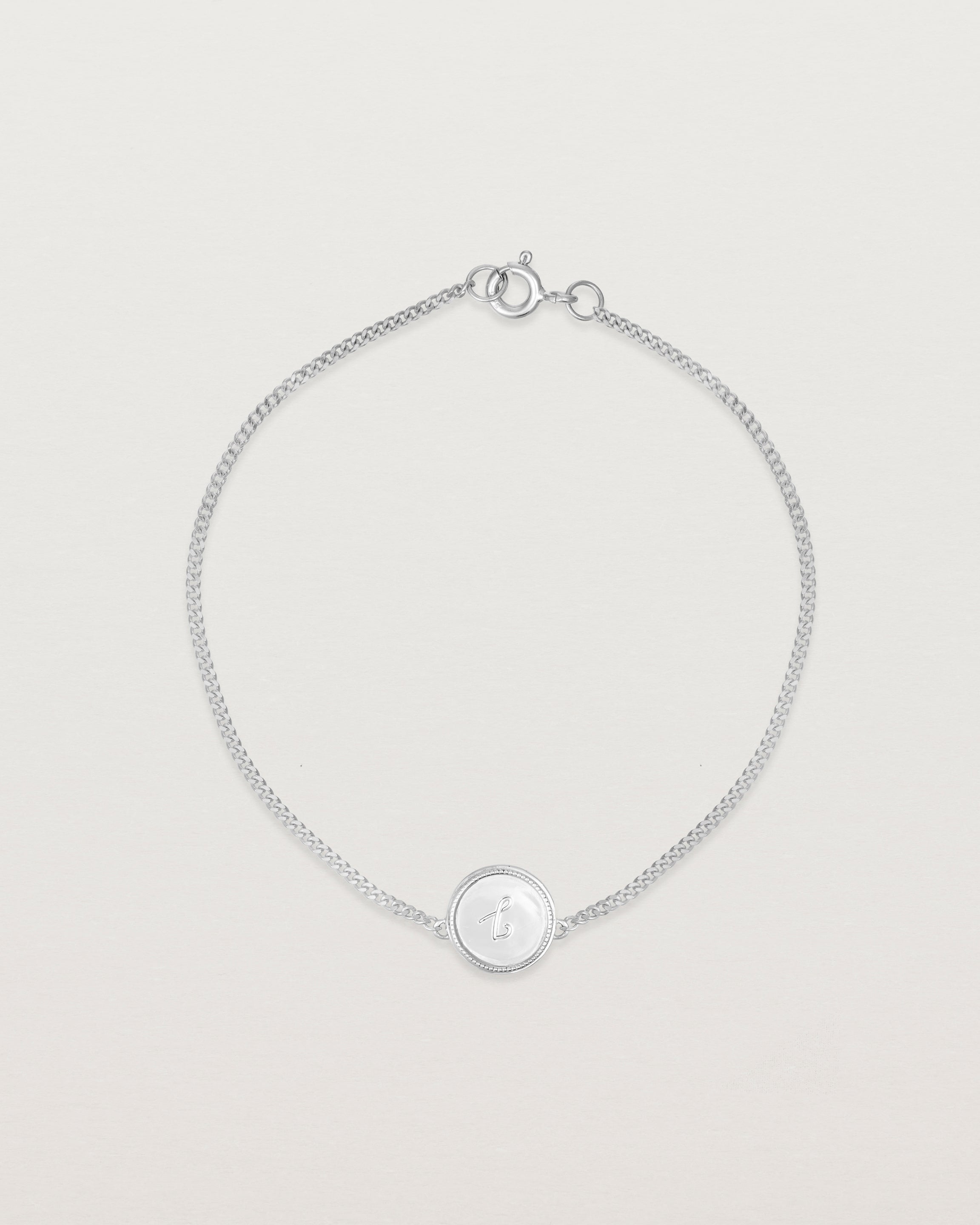 Top down view of the Precious Initial Bracelet in white gold.