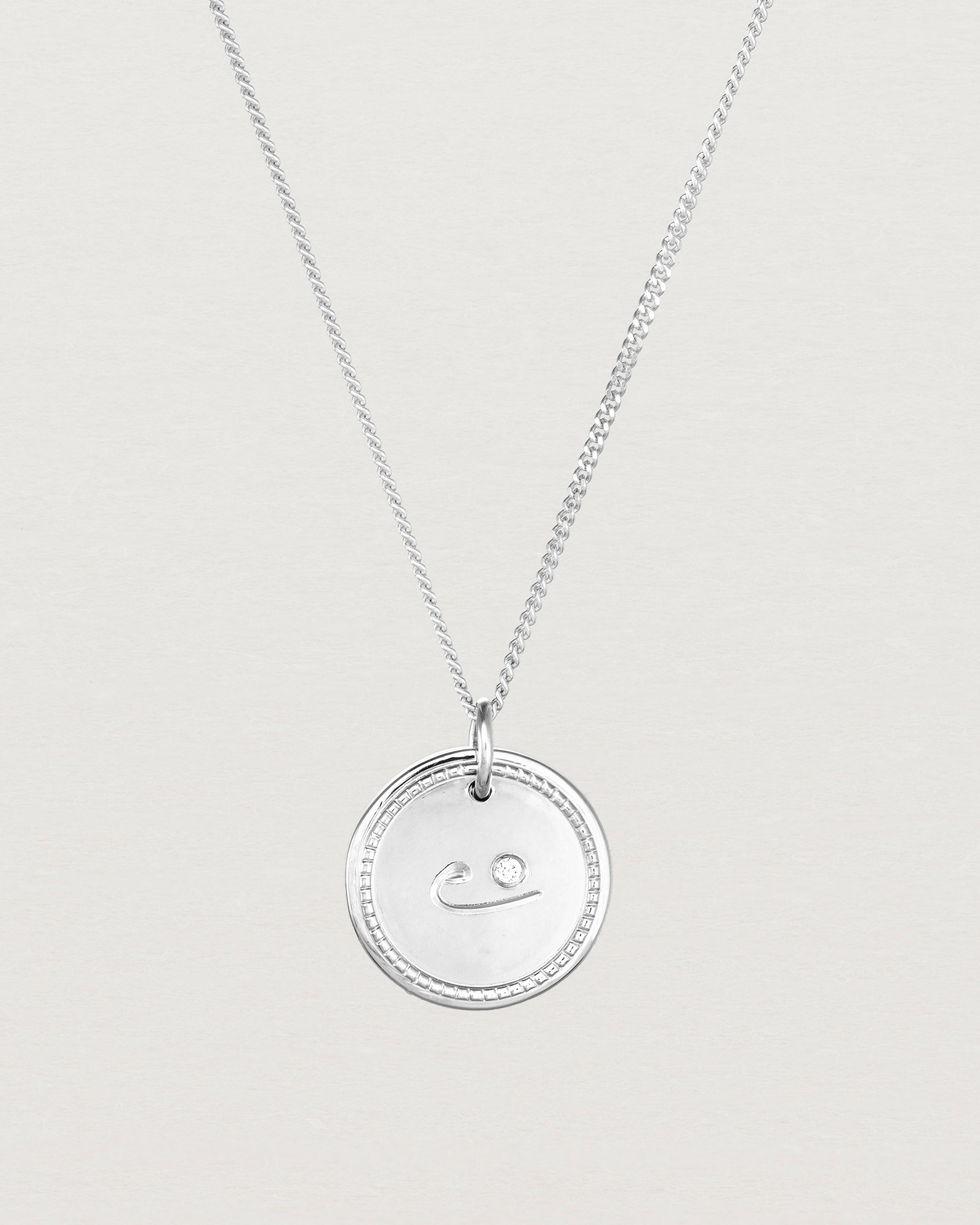 Close up view of the Precious Initial Necklace | Birthstone in sterling silver.