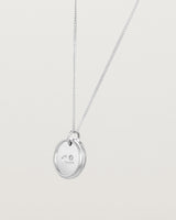 Angled view of the Precious Initial Necklace | Birthstone in sterling silver.