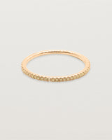 Yellow gold band featuring pave set yellow champagne diamonds.