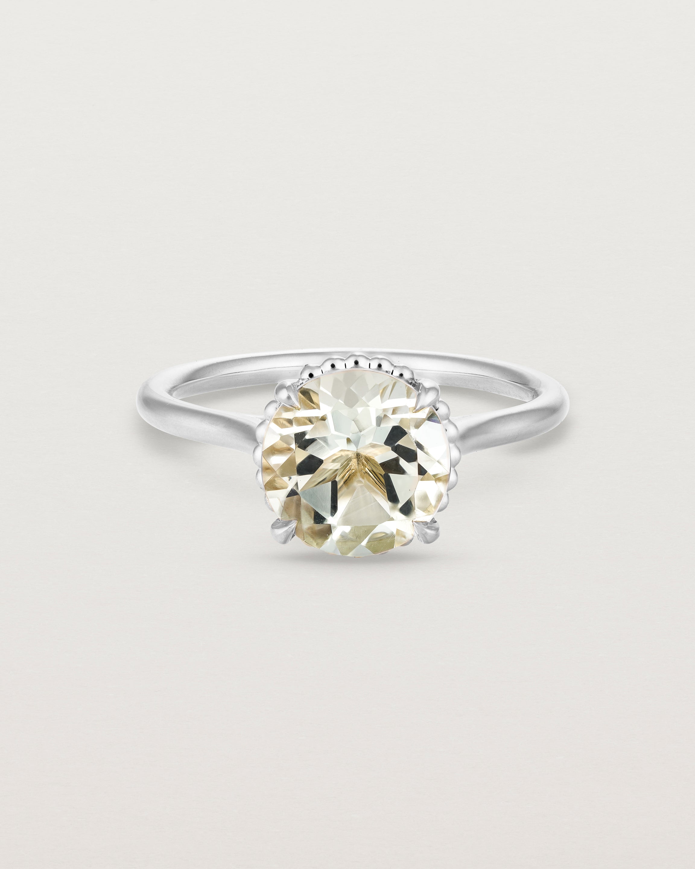 Front view of the Thea Round Solitaire | Green Amethyst in white gold.