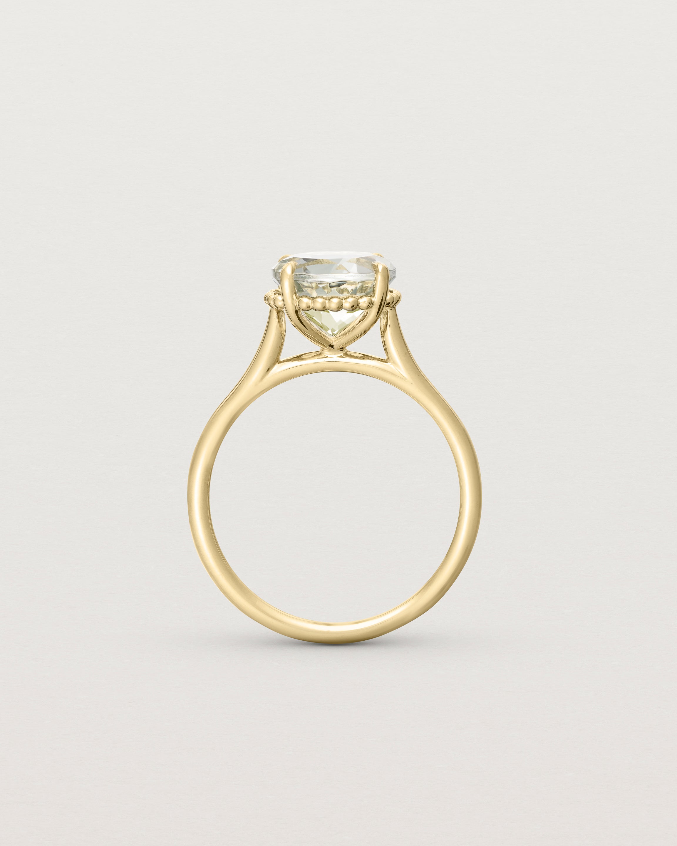 Standing view of the Thea Round Solitaire | Green Amethyst in yellow gold.