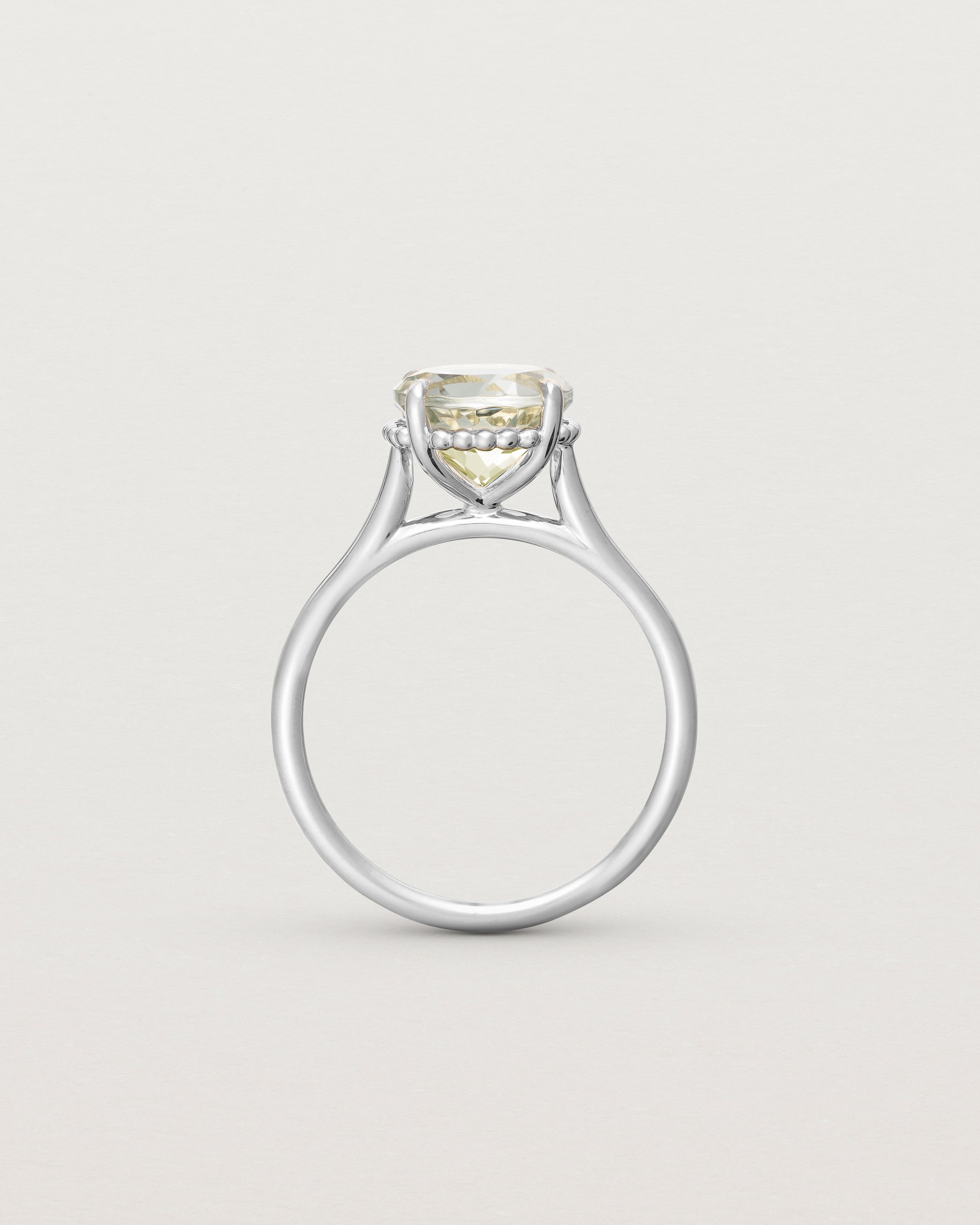 Standing view of the Thea Round Solitaire | Green Amethyst in white gold.
