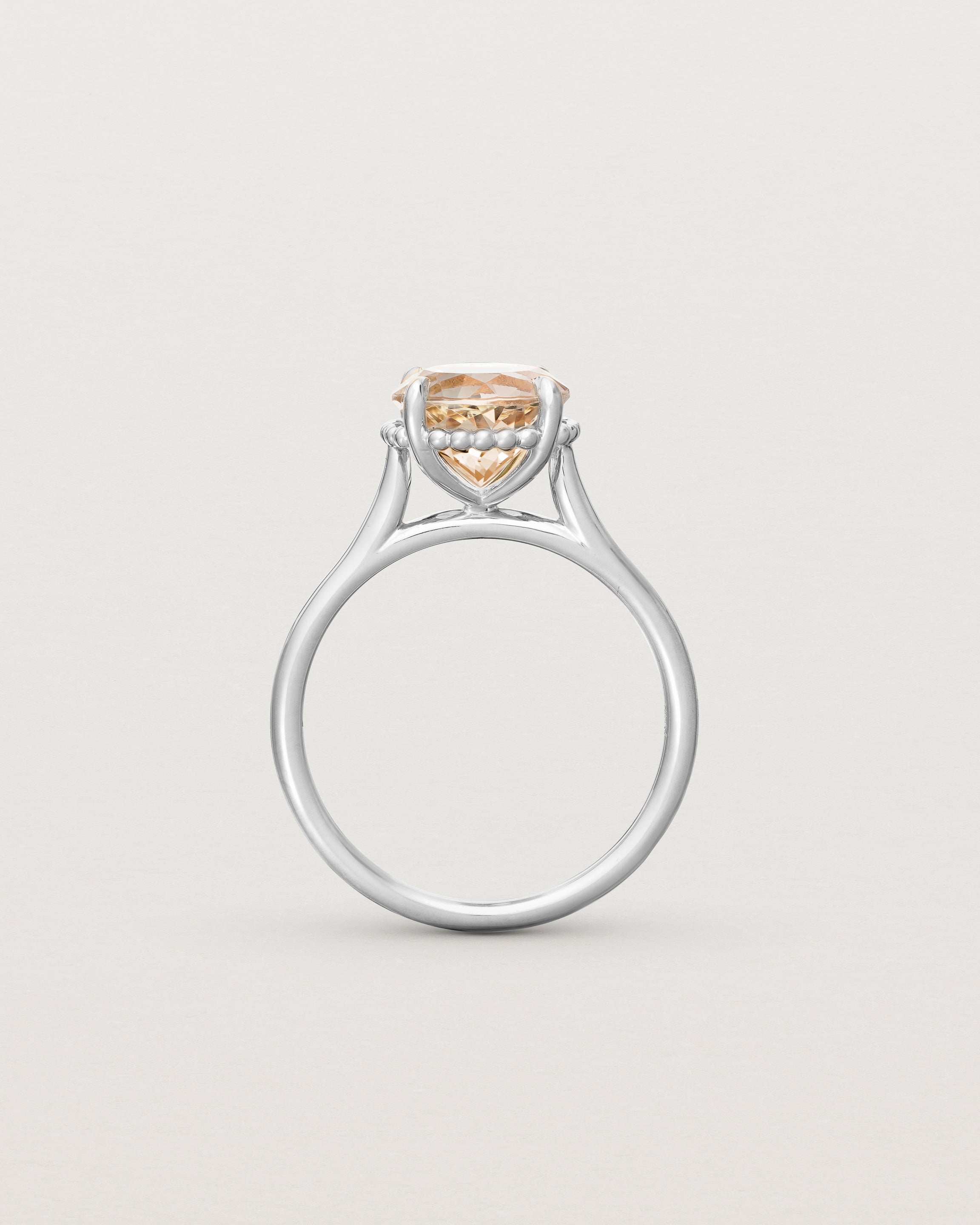 Standing view of the Thea Round Solitaire | Savannah Sunstone in white gold.