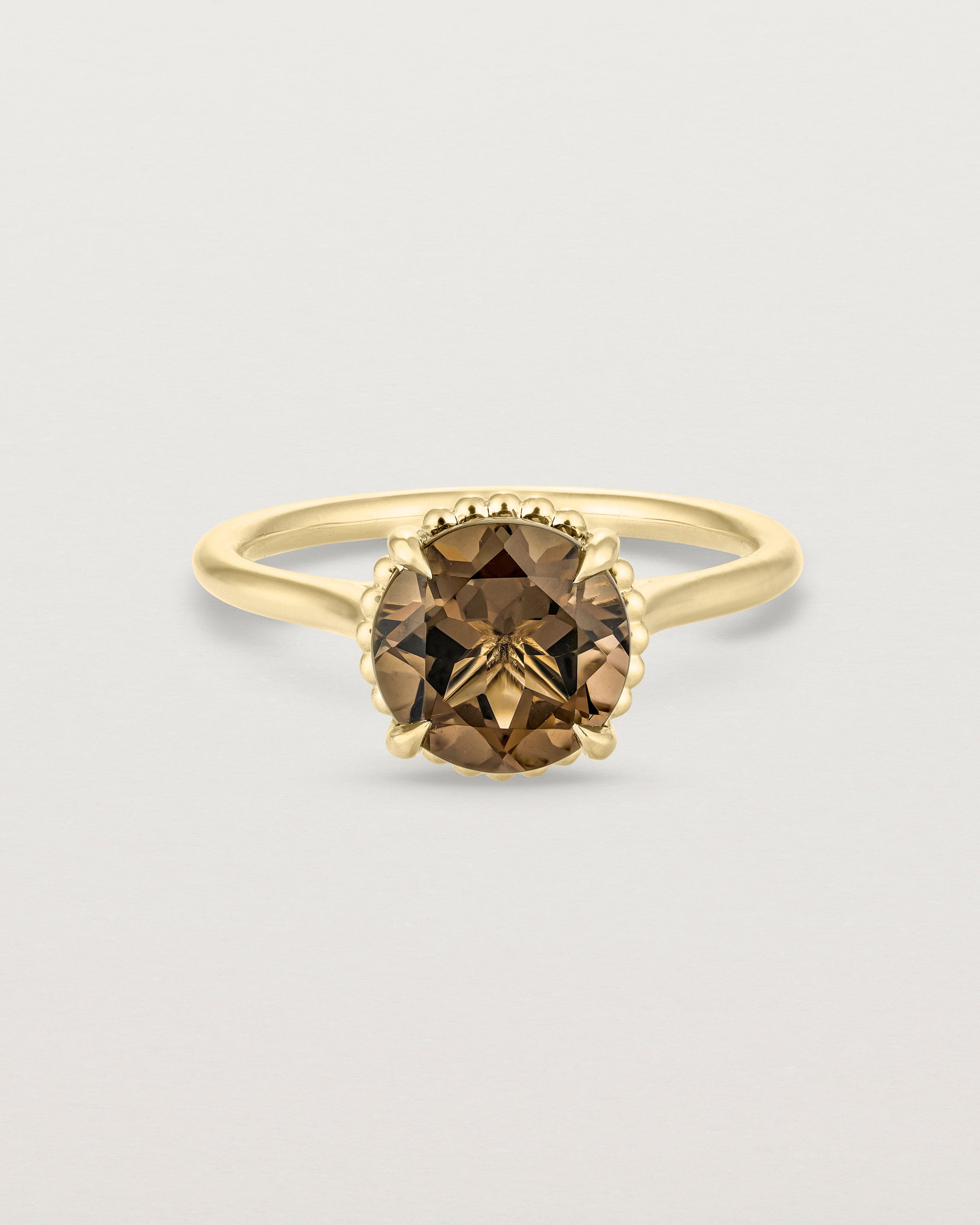 Front view of the Thea Round Solitaire | Smokey Quartz in yellow gold.