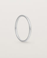 Side view of our fine round wedding band in white gold