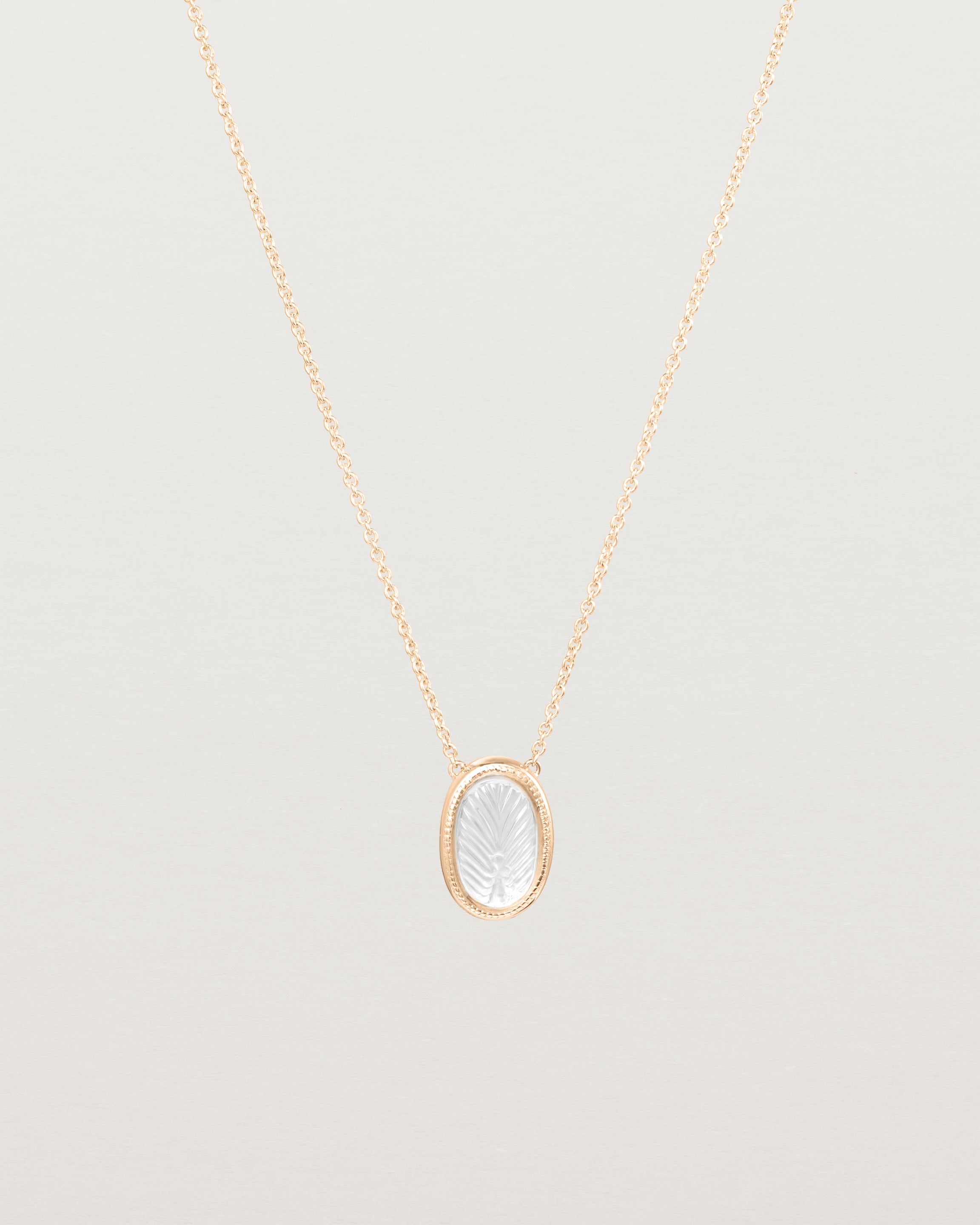 Front view of the Ruan Necklace | Carved Quartz in rose gold.
