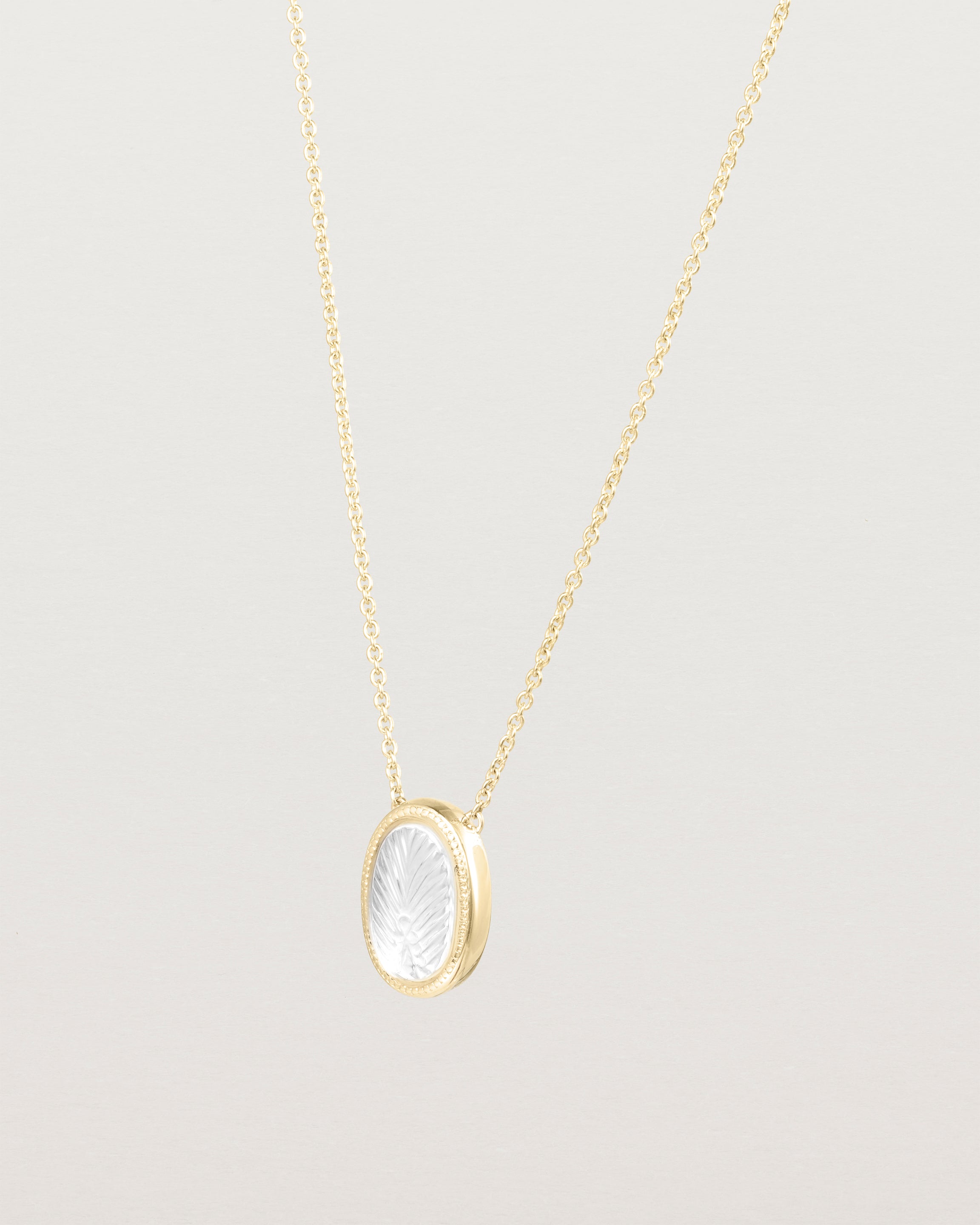Angled view of the Ruan Necklace | Carved Quartz in yellow gold
