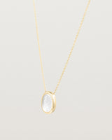 Angled view of the Ruan Necklace | Carved Quartz in yellow gold