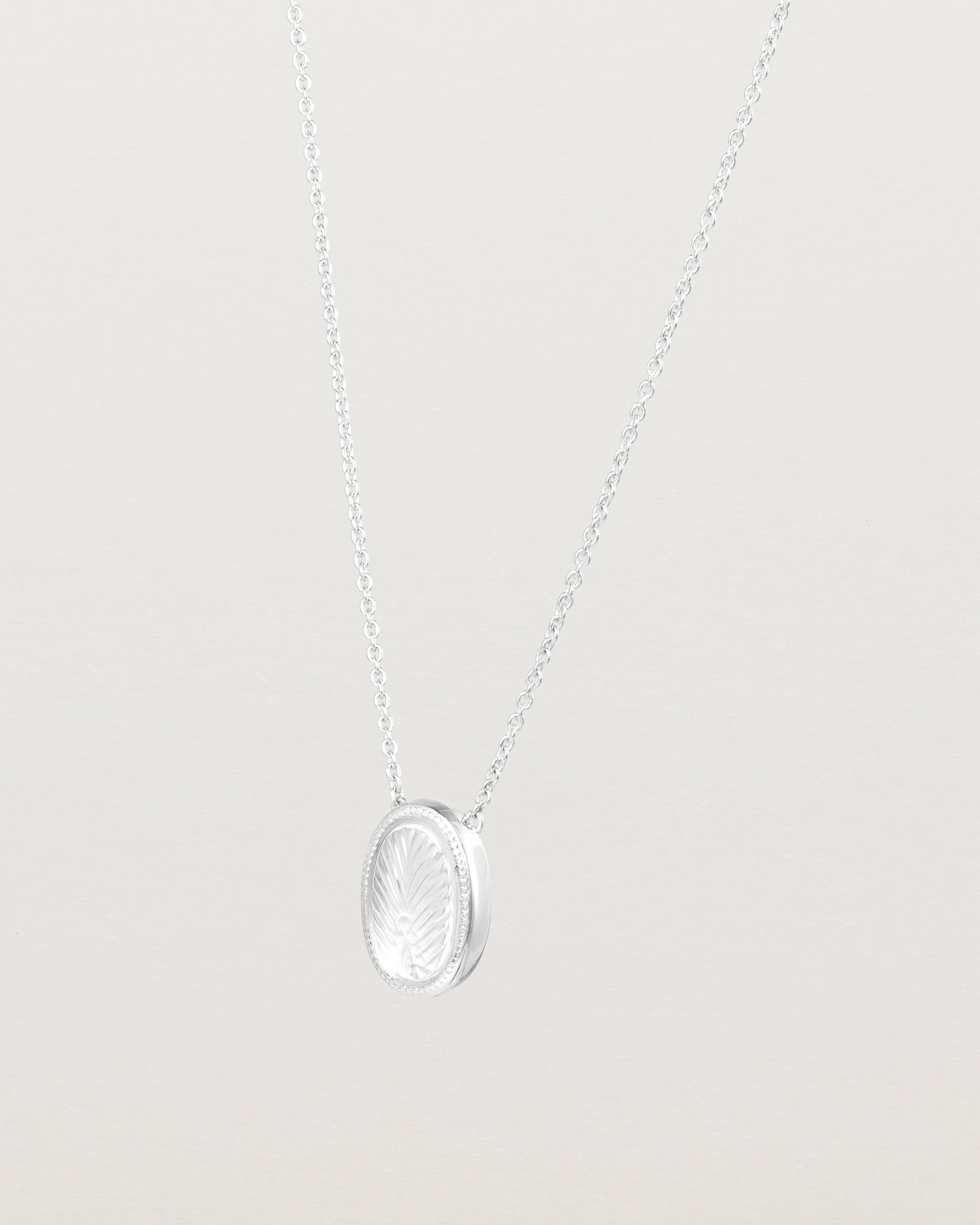 Angled view of the Ruan Necklace | Carved Quartz in sterling silver.