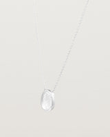 Angled view of the Ruan Necklace | Carved Quartz in sterling silver.