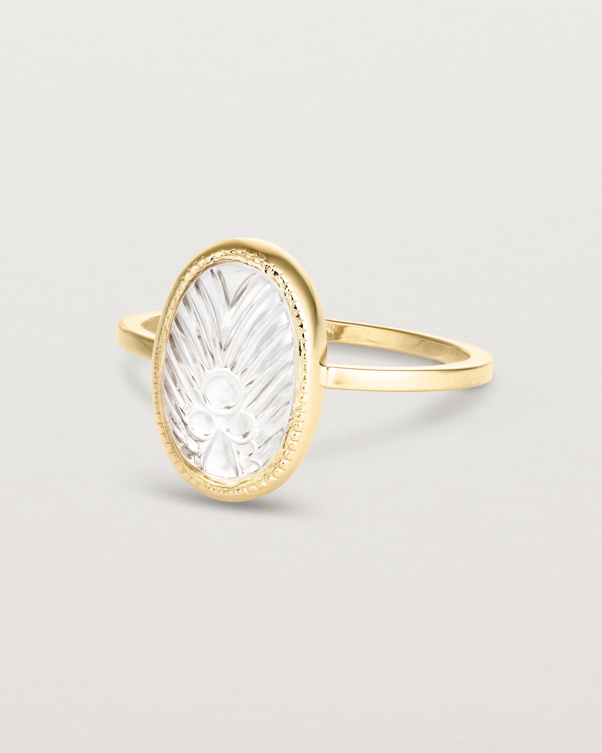 Angled view of the Ruan Ring | Carved Quartz in yellow gold.