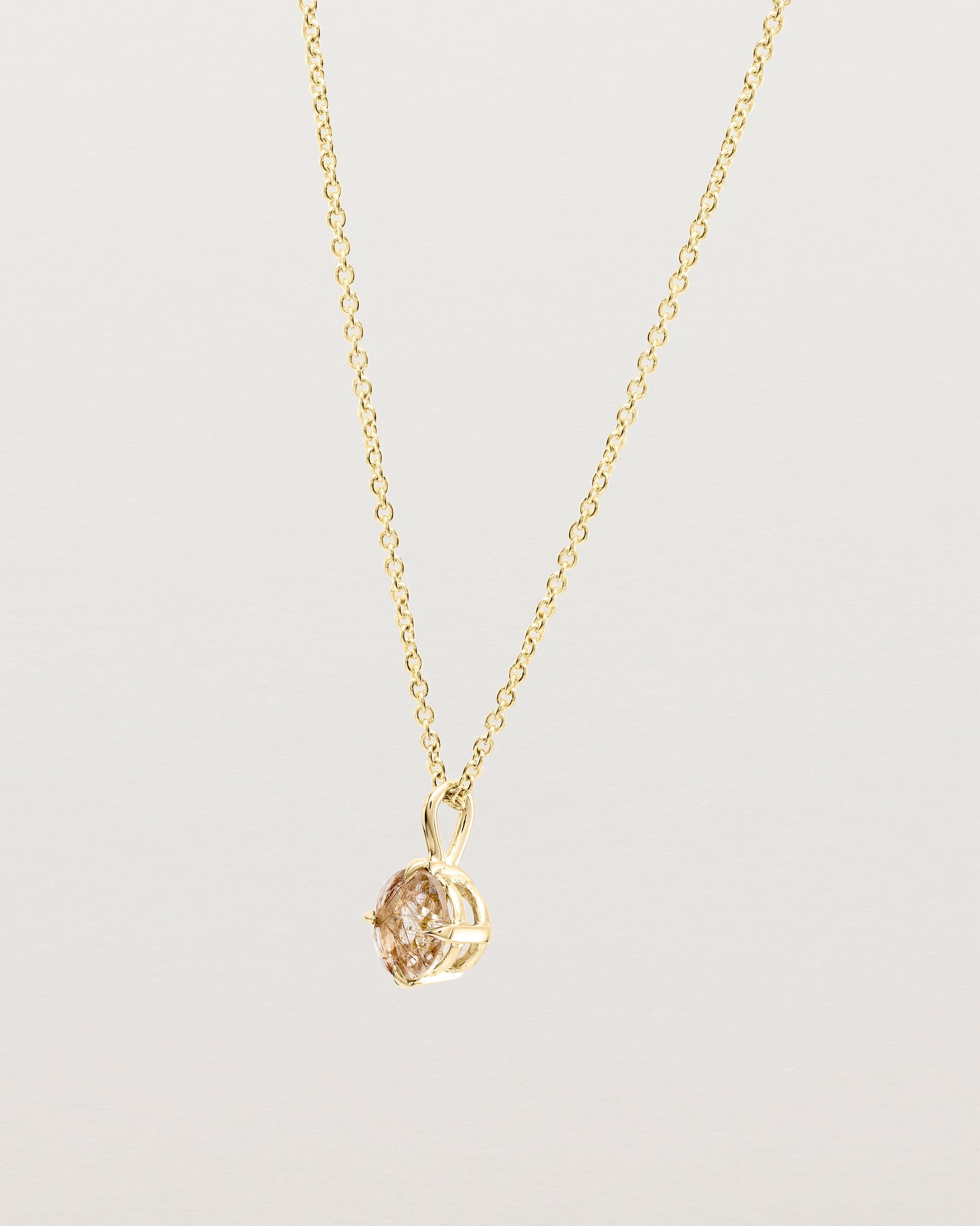 Angled view of the Una Necklace | Rutilated Quartz | Yellow Gold.