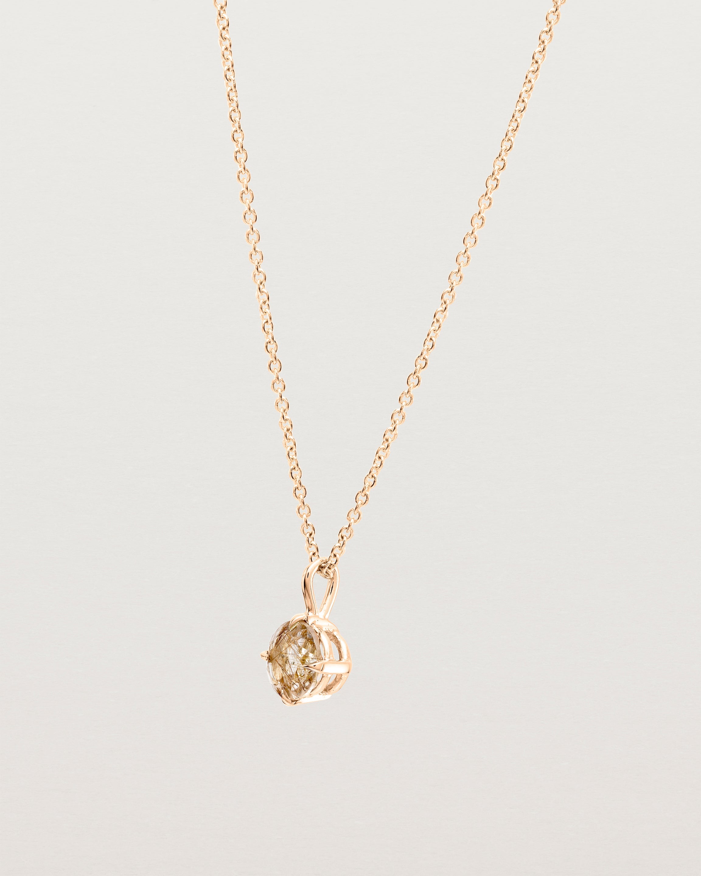 Angled view of the Una Necklace | Rutilated Quartz | Rose Gold.