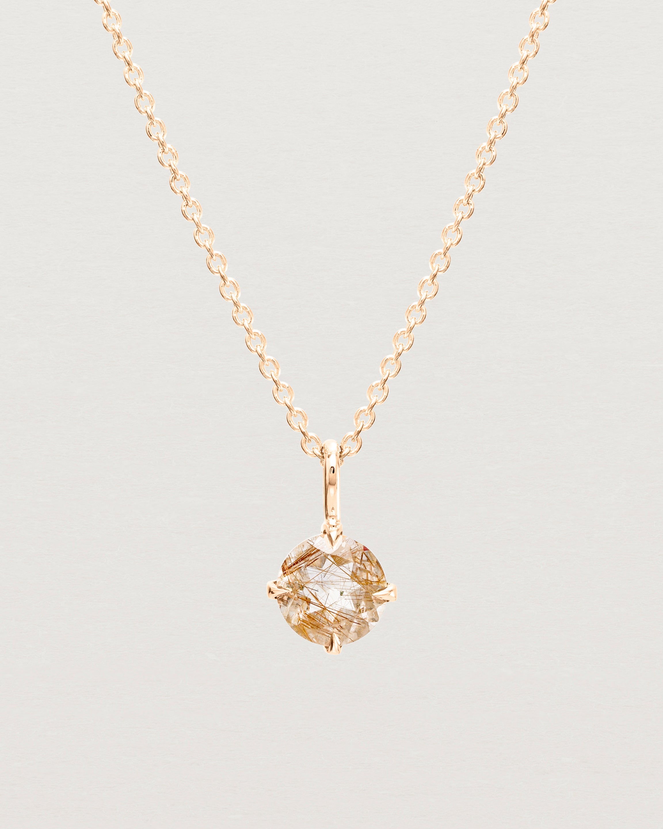 Close up view of the Una Necklace | Rutilated Quartz | Rose Gold.