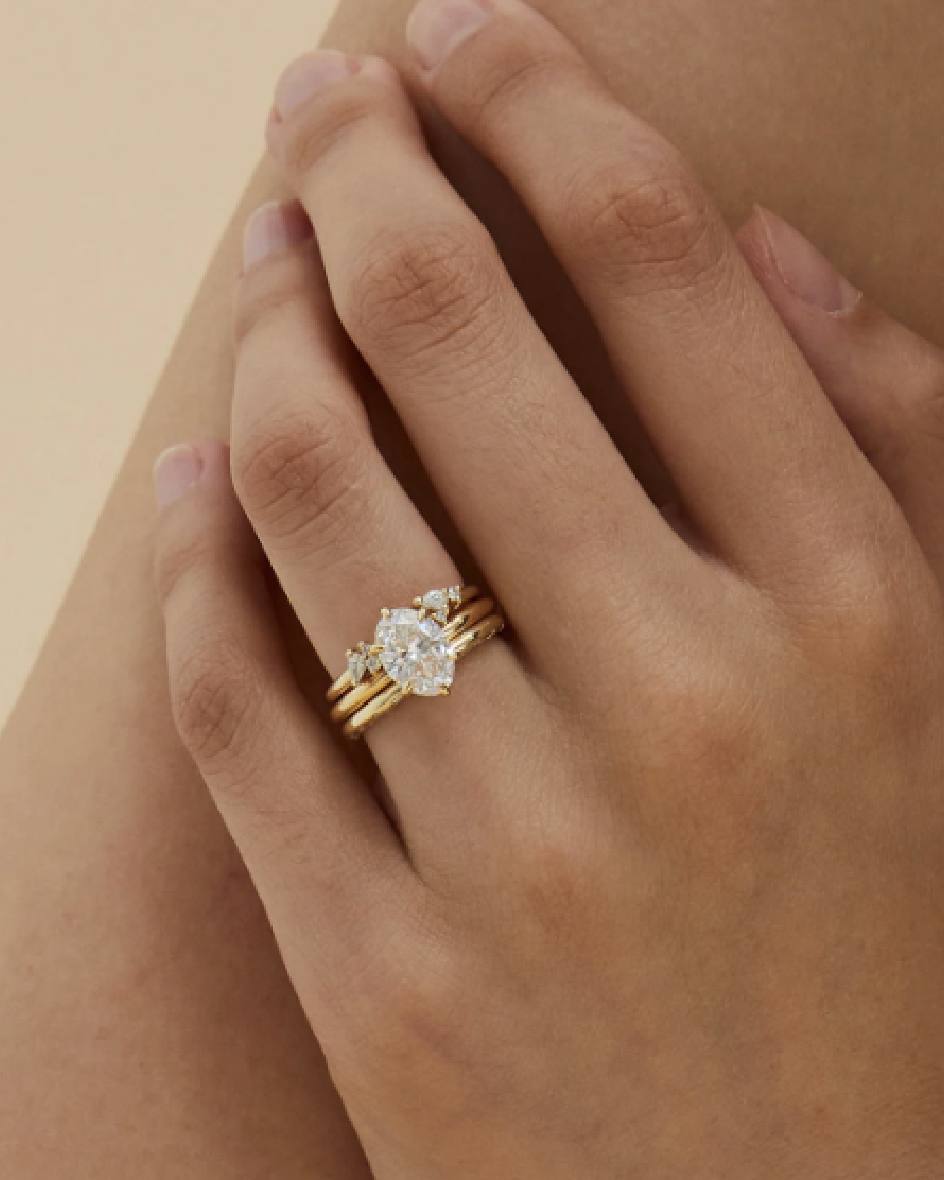Yellow gold engagement discount rings on hand