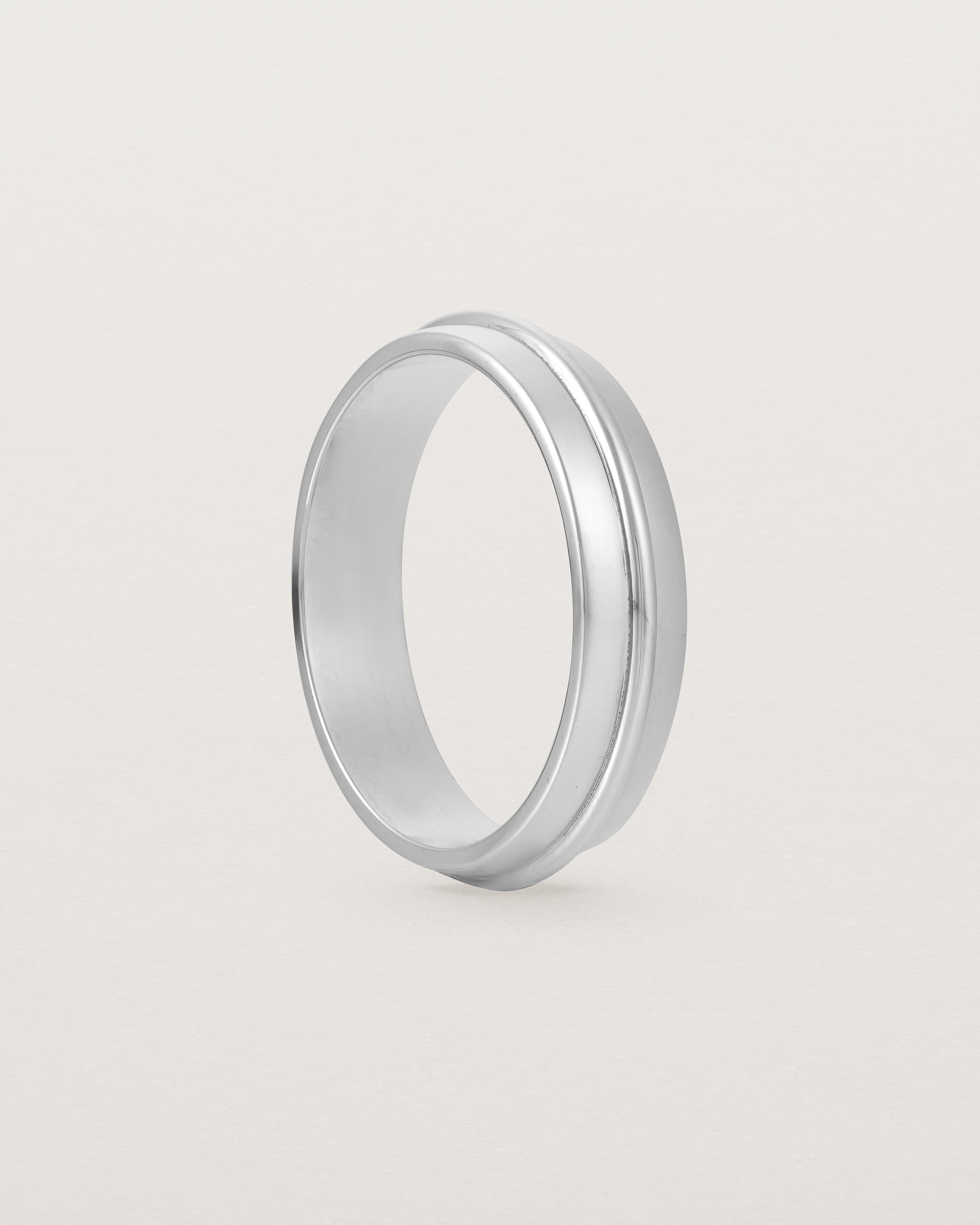 Angled view of the Seam Wedding Ring | 5mm | White Gold