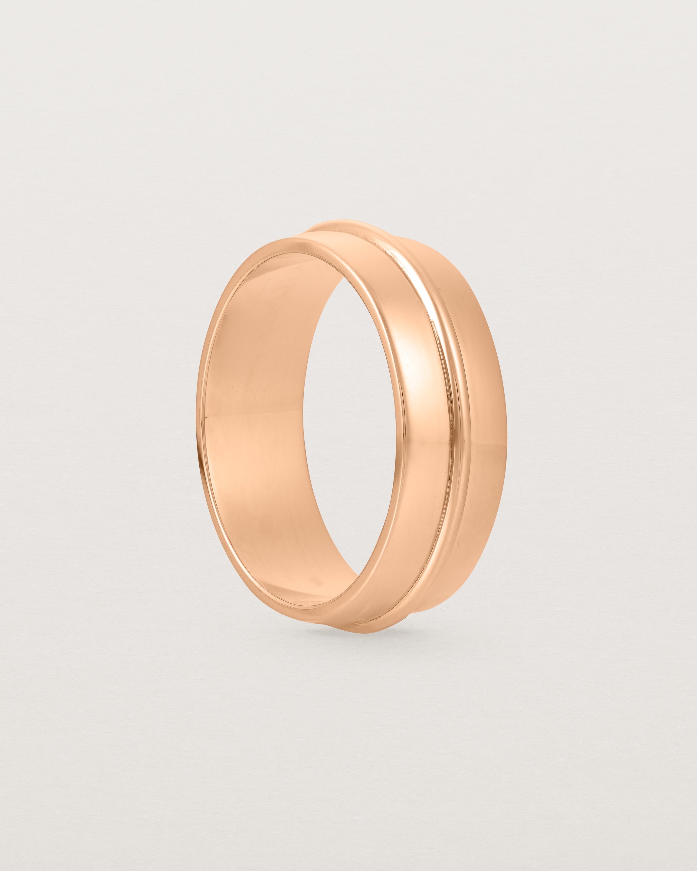 Standing view of the Seam Wedding Ring | 7mm | Rose Gold.