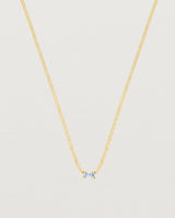 Close up of the Sena Slider Necklace with Pale Blue Sapphire in yellow gold.