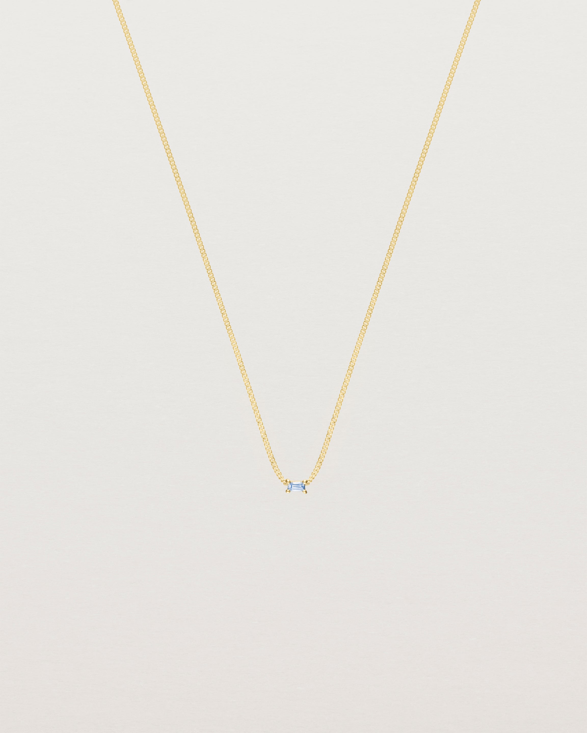 Front view of the Sena Slider Necklace with Pale Blue Sapphire in yellow gold.