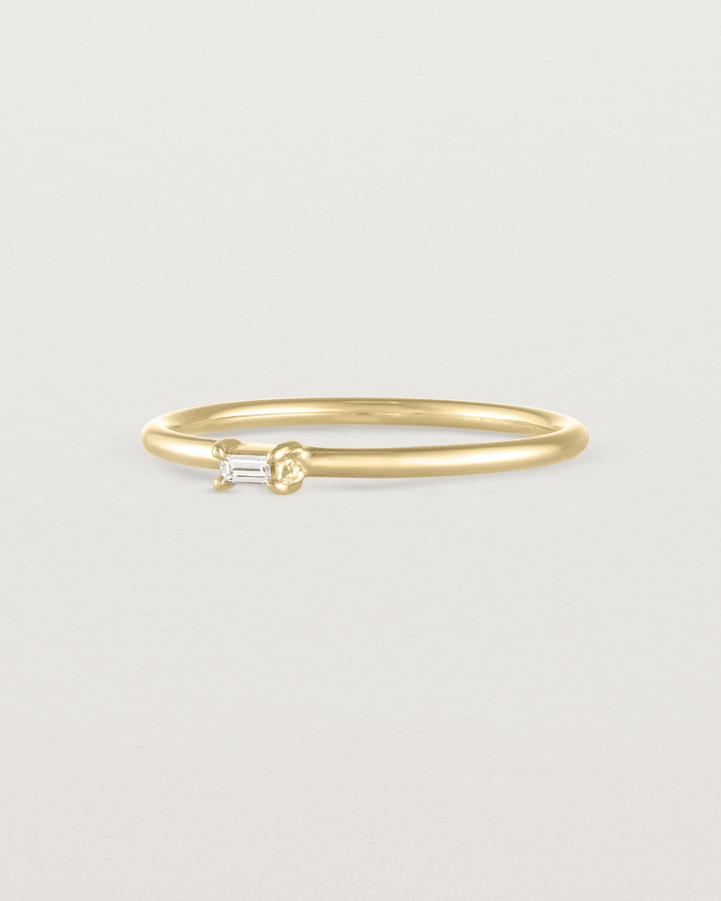 Angled view of the Sena Stacking Ring | Diamond in yellow gold.