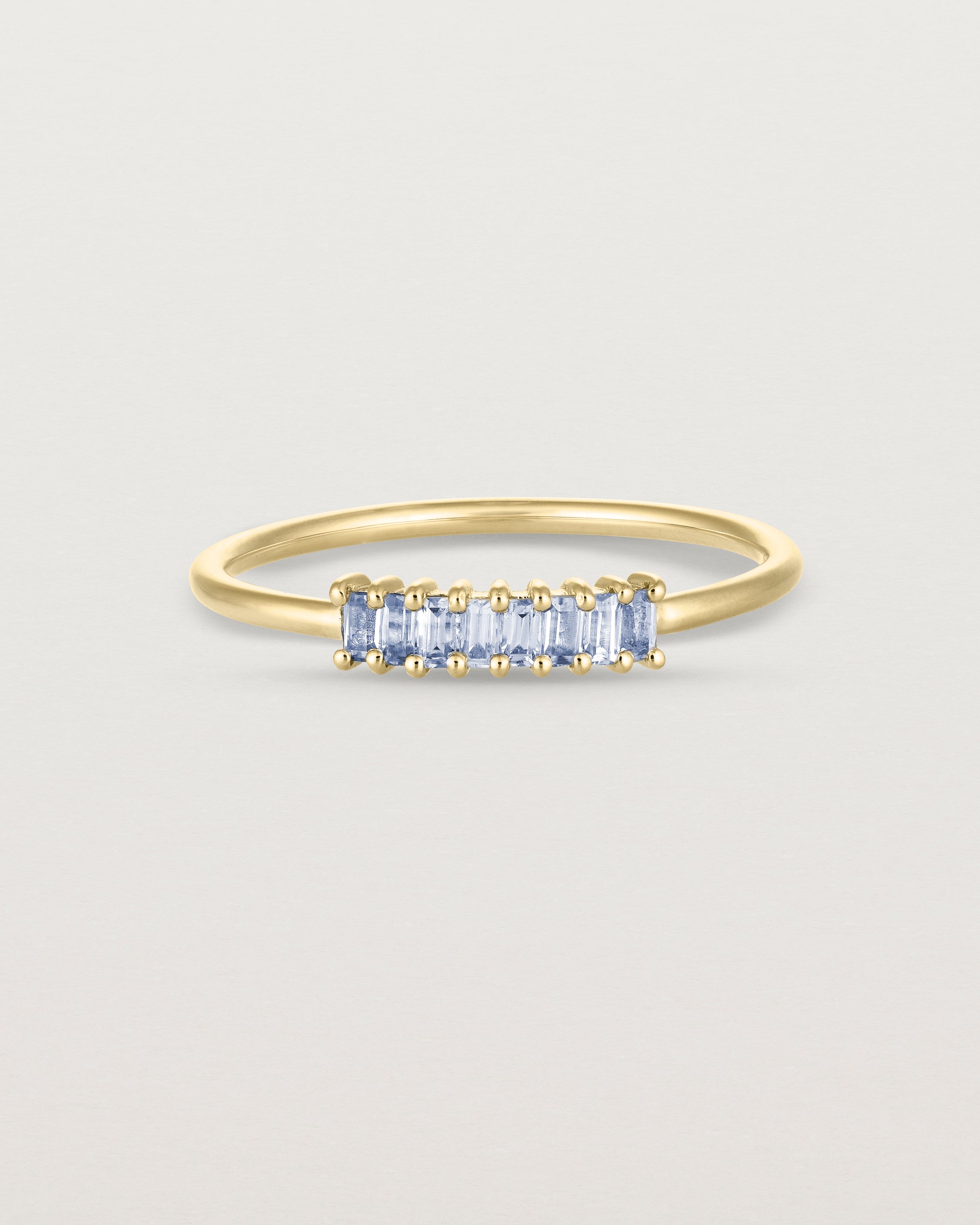 Front view of the Sena Wrap Ring | Sapphire in yellow gold.