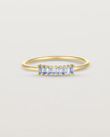 Front view of the Sena Wrap Ring | Sapphire in yellow gold.