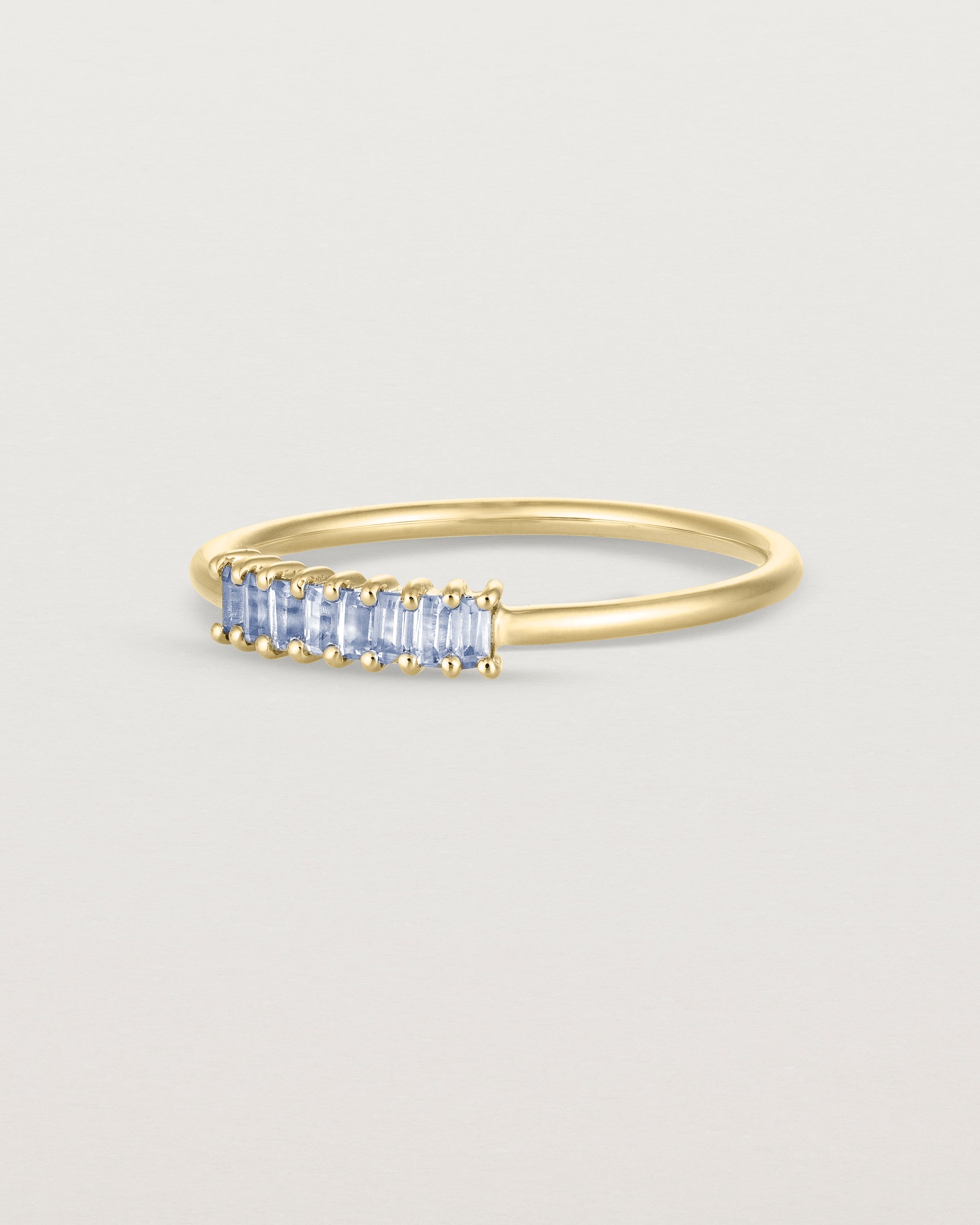 Angled view of the Sena Wrap Ring | Sapphire in yellow gold.