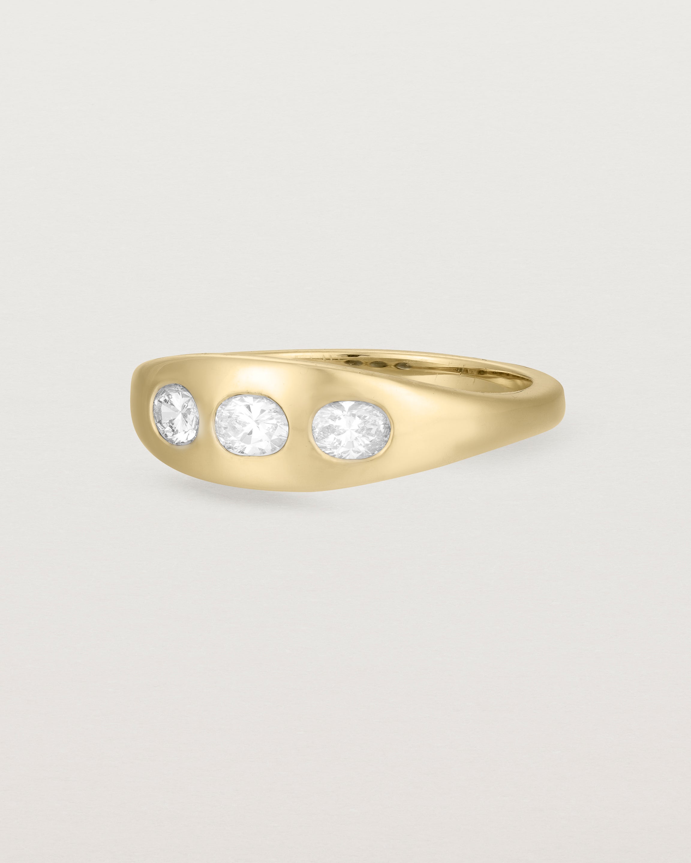 Angled view of the Seule Trinity Ring | Diamonds | Yellow Gold.