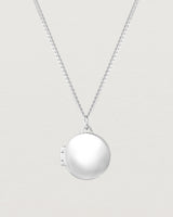 Close up view of the Signature Locket in sterling silver.