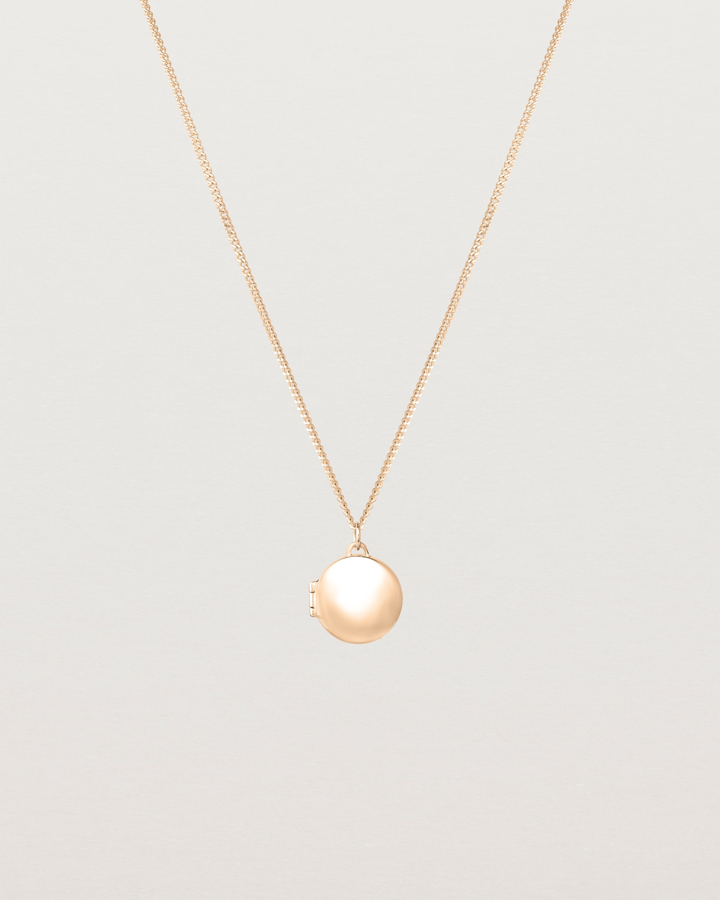 Front view of the Signature Locket in rose gold.