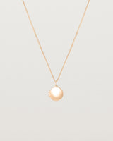 Front view of the Signature Locket in rose gold.