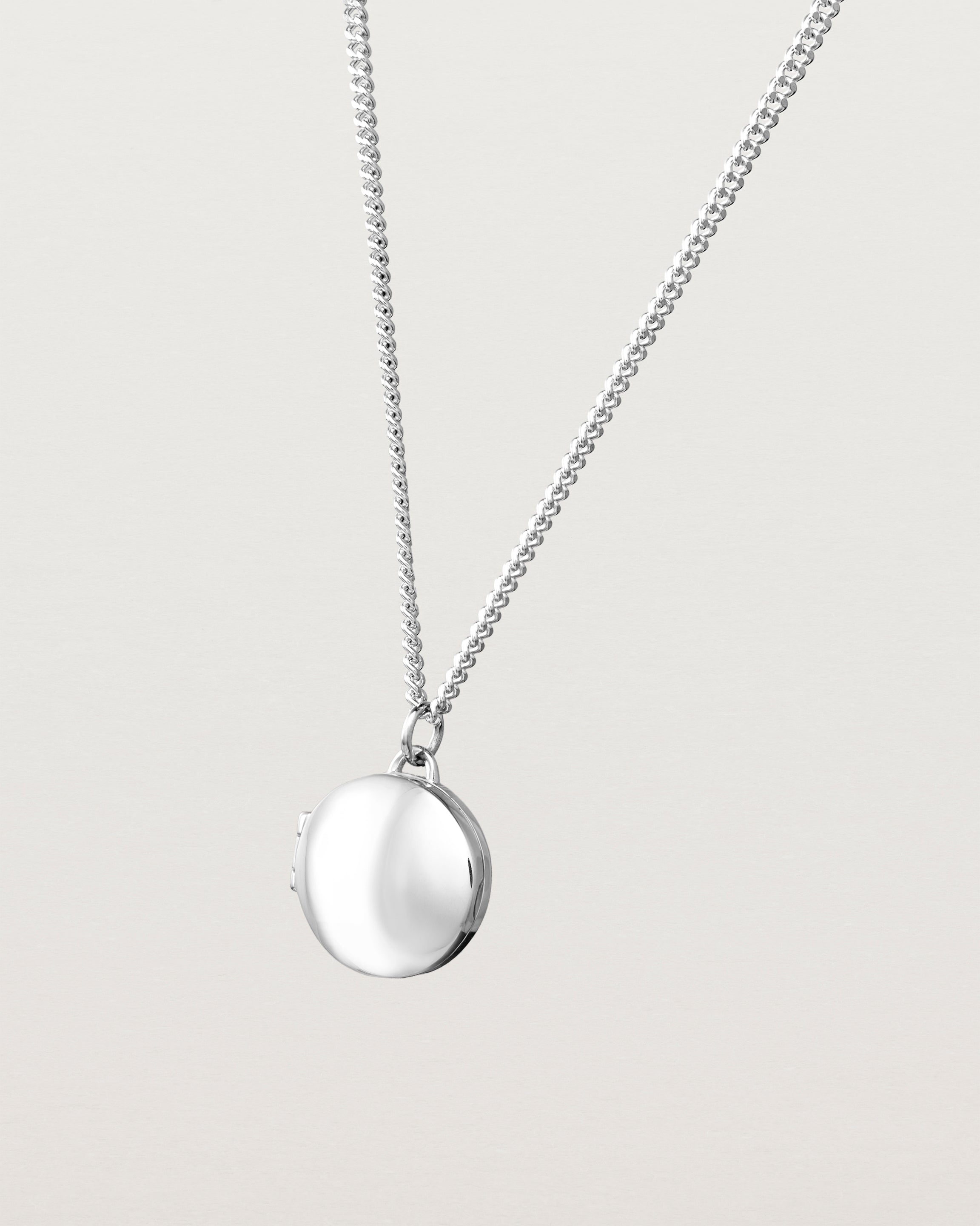 Angled view of the Signature Locket in sterling silver.