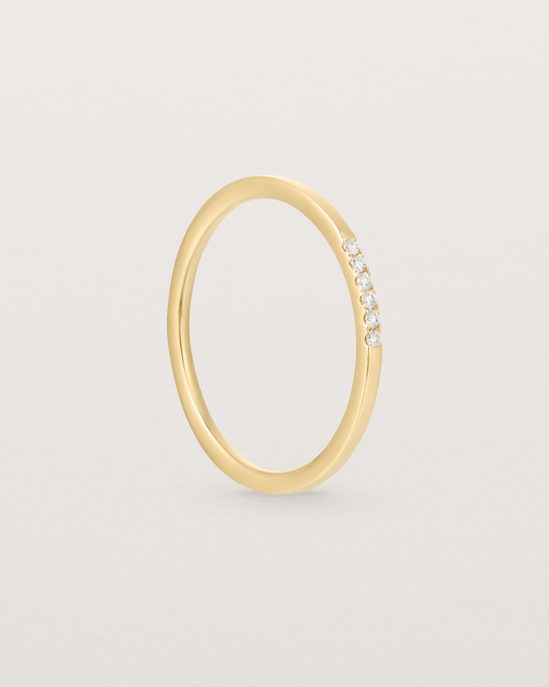 Standinf view of the Six Stone Queenie Ring | Diamonds in Yellow Gold.